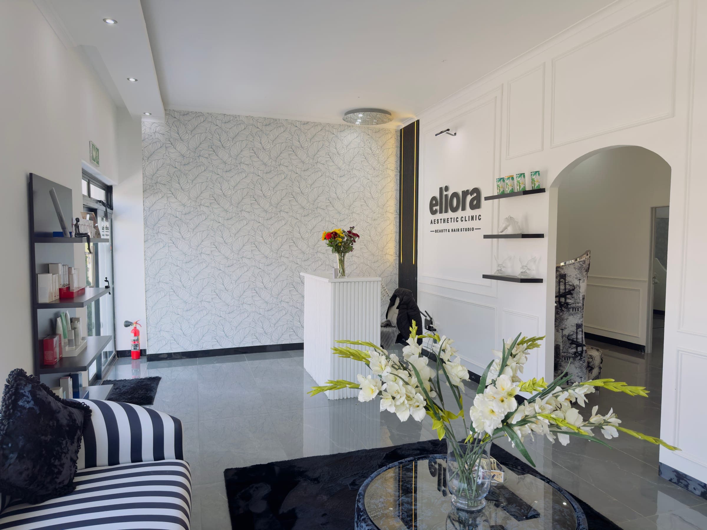 Panel moulding wall with leaf-print wallpaper, reception