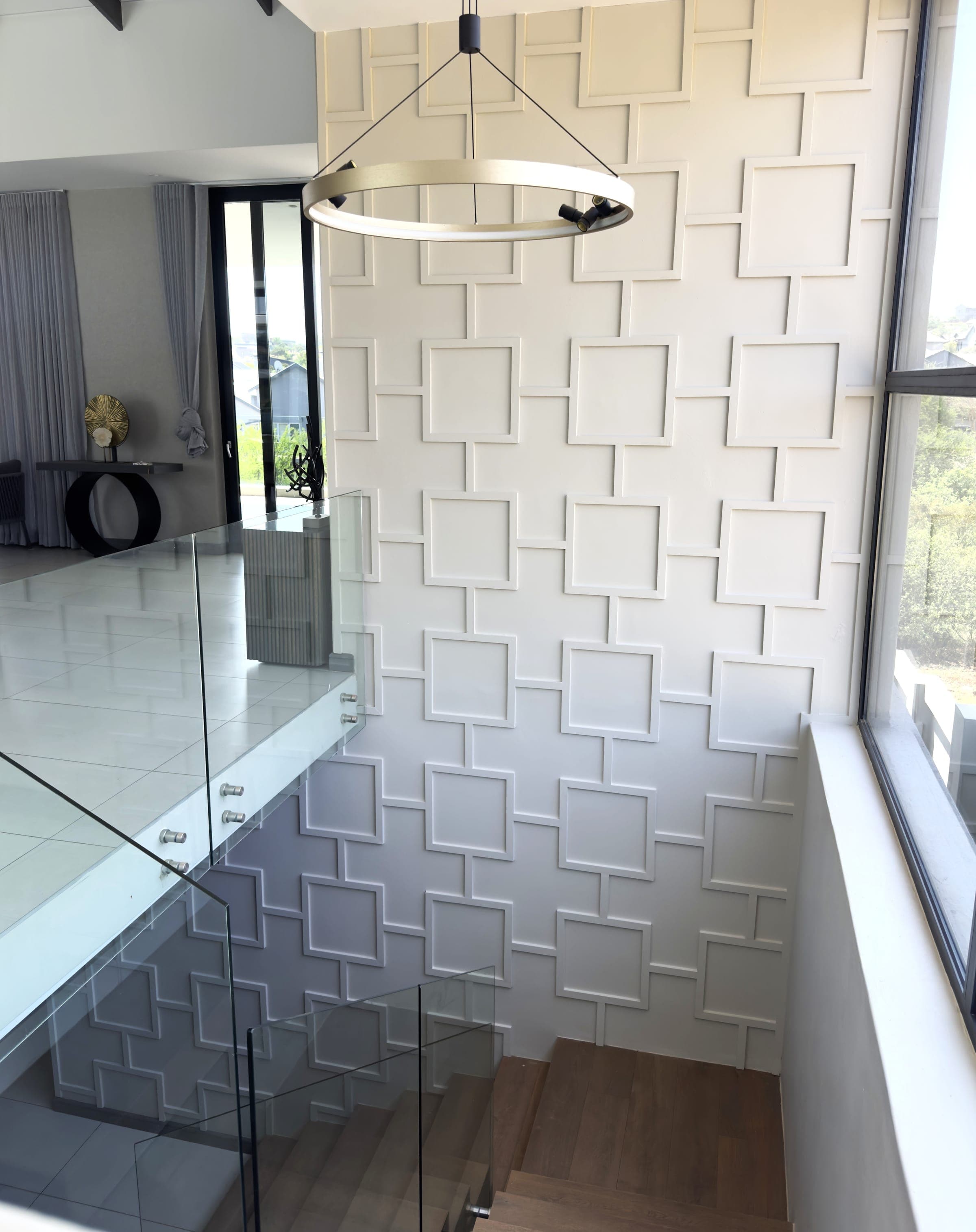 Double-height geometric panel wall, stairwell